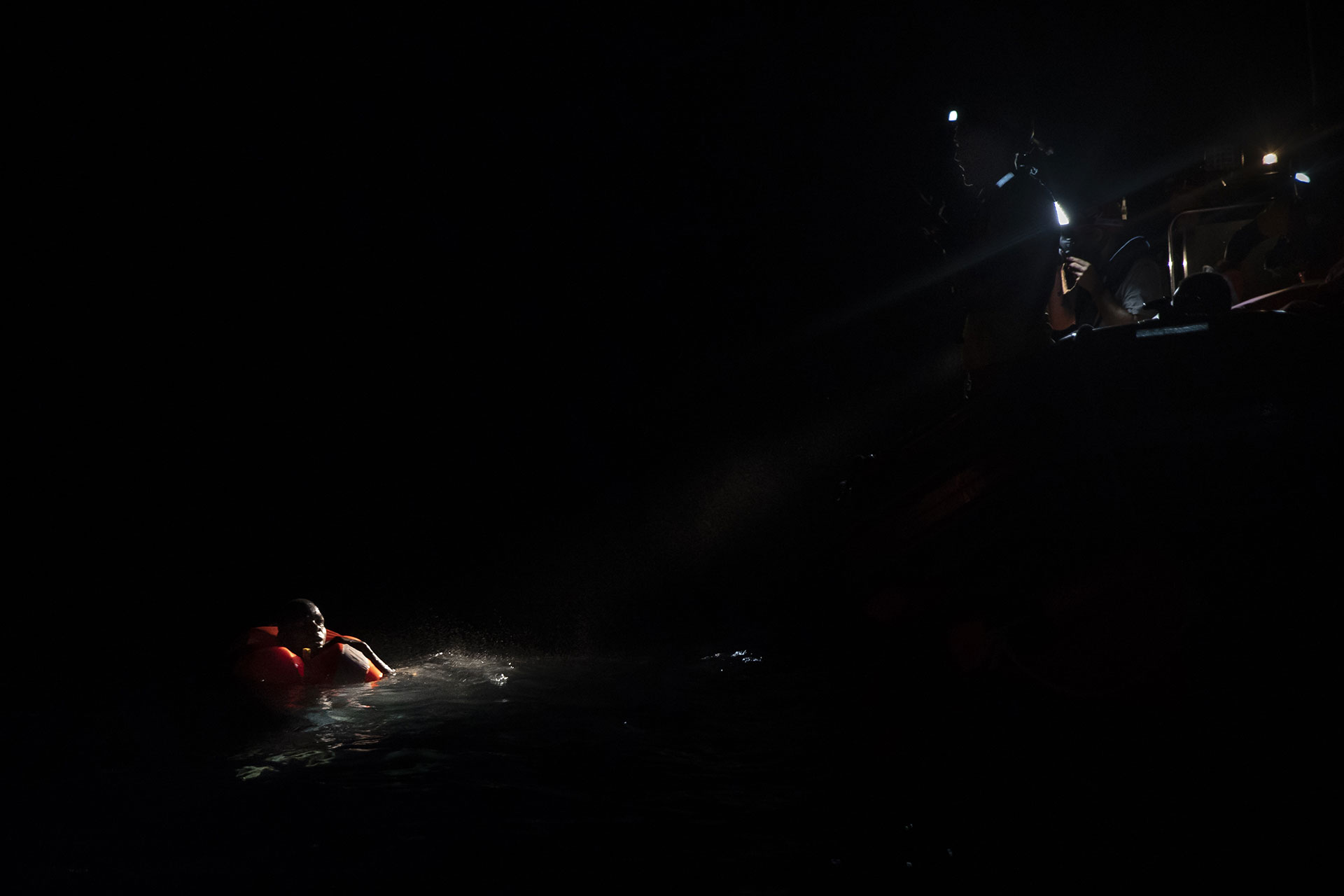 Mohamed, 17, from The Gambia, floating in the water during a search and rescue operation organised by the NGO Proactiva Open Arms on 2 August 2018.