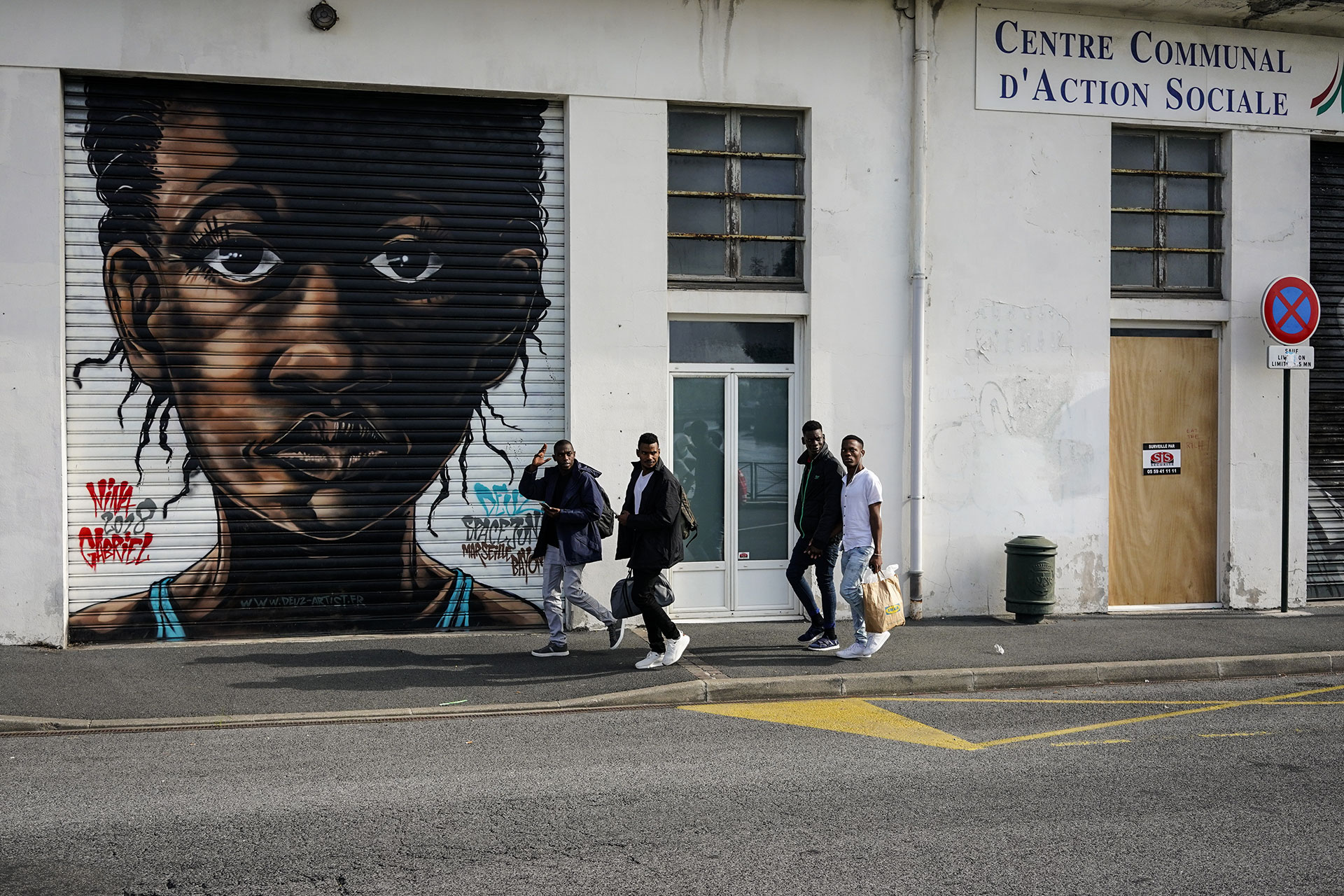 Ousmane walks with three companions towards the ¨La Pausa¨ refugee reception center in Bayonne, September 17, 2019.