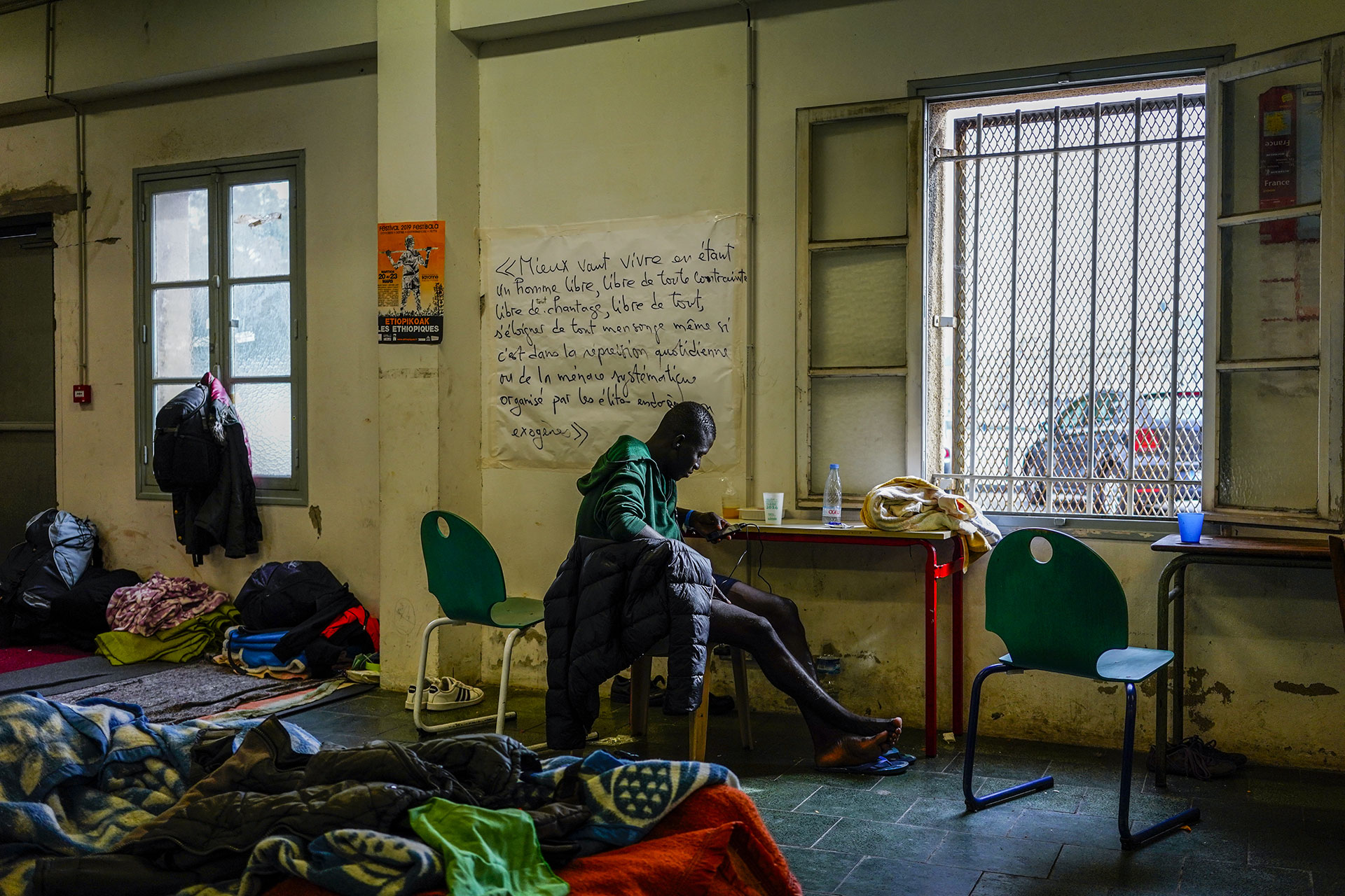 A young man who has crossed the border from Spain rests at the ¨La Pausa¨ refugee reception center in Bayonne, September 17, 2019.