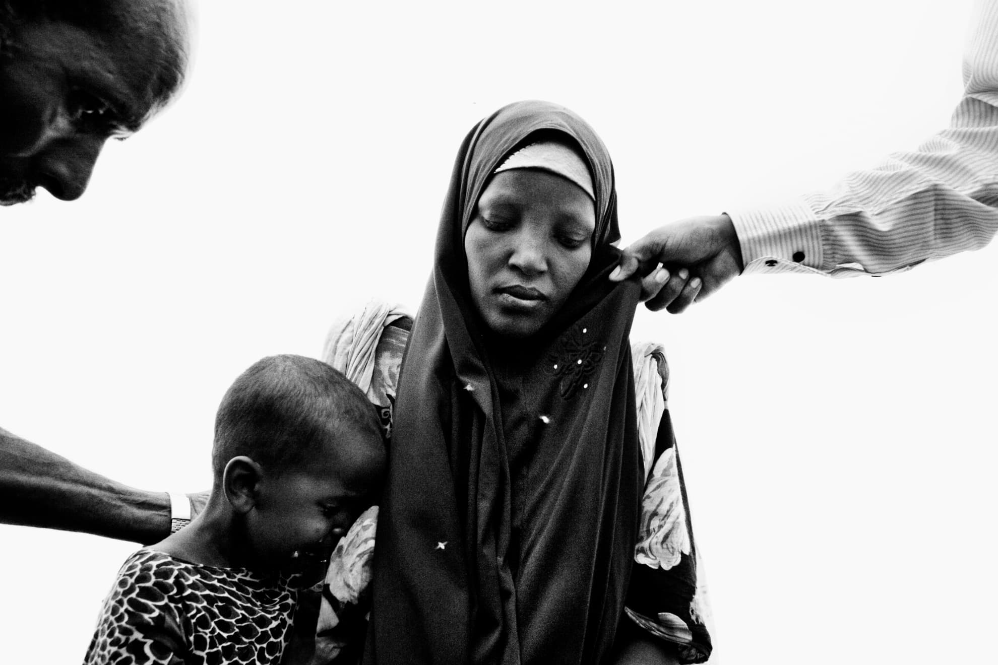 A young woman and her child at the moment of registration in the Dadaab refugee camp in northeastern Kenya.