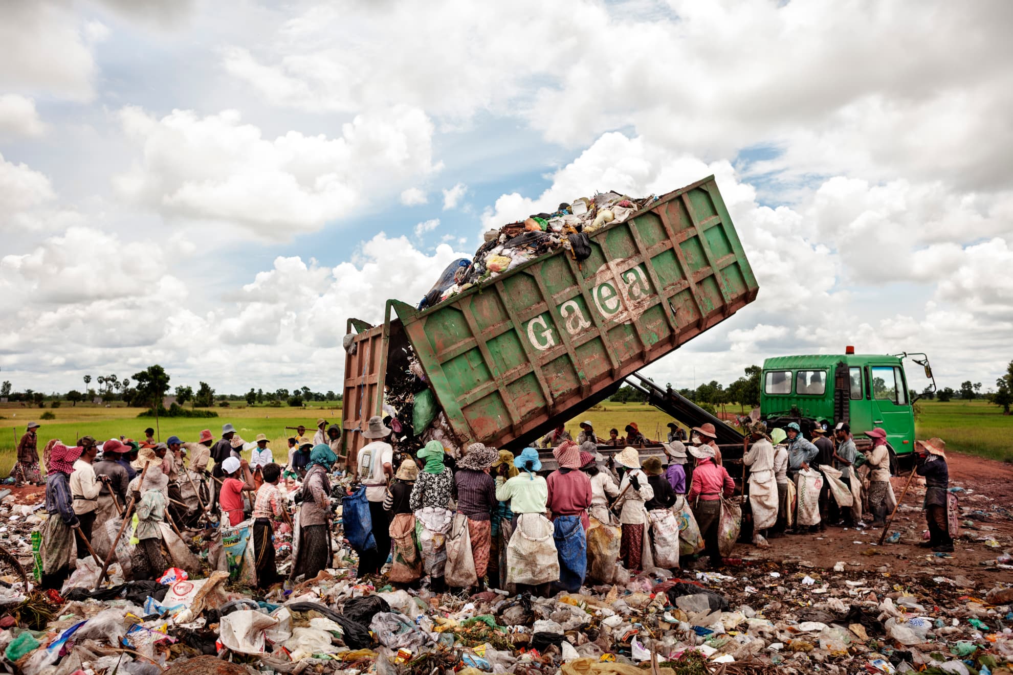 A truck loaded with waste arrives at the Siem Reap rubbish dump in Cambodia. It is estimated that 20 minors work with their families there.