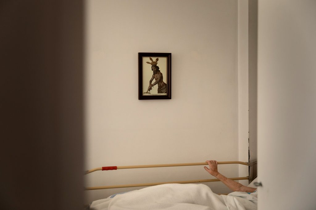 An elderly woman remains confined in her room at a nursing home due to the pandemic, province of Barcelona, Spain, April 26, 2020.