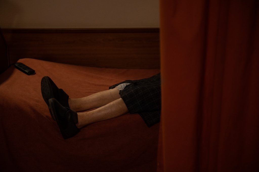 An elderly woman rests on her bed at a nursing home after a team of volunteers from the Spanish NGO Open Arms had performed a PCR test for the detection of coronavirus, province of Barcelona, ​​Spain, April 14, 2020.