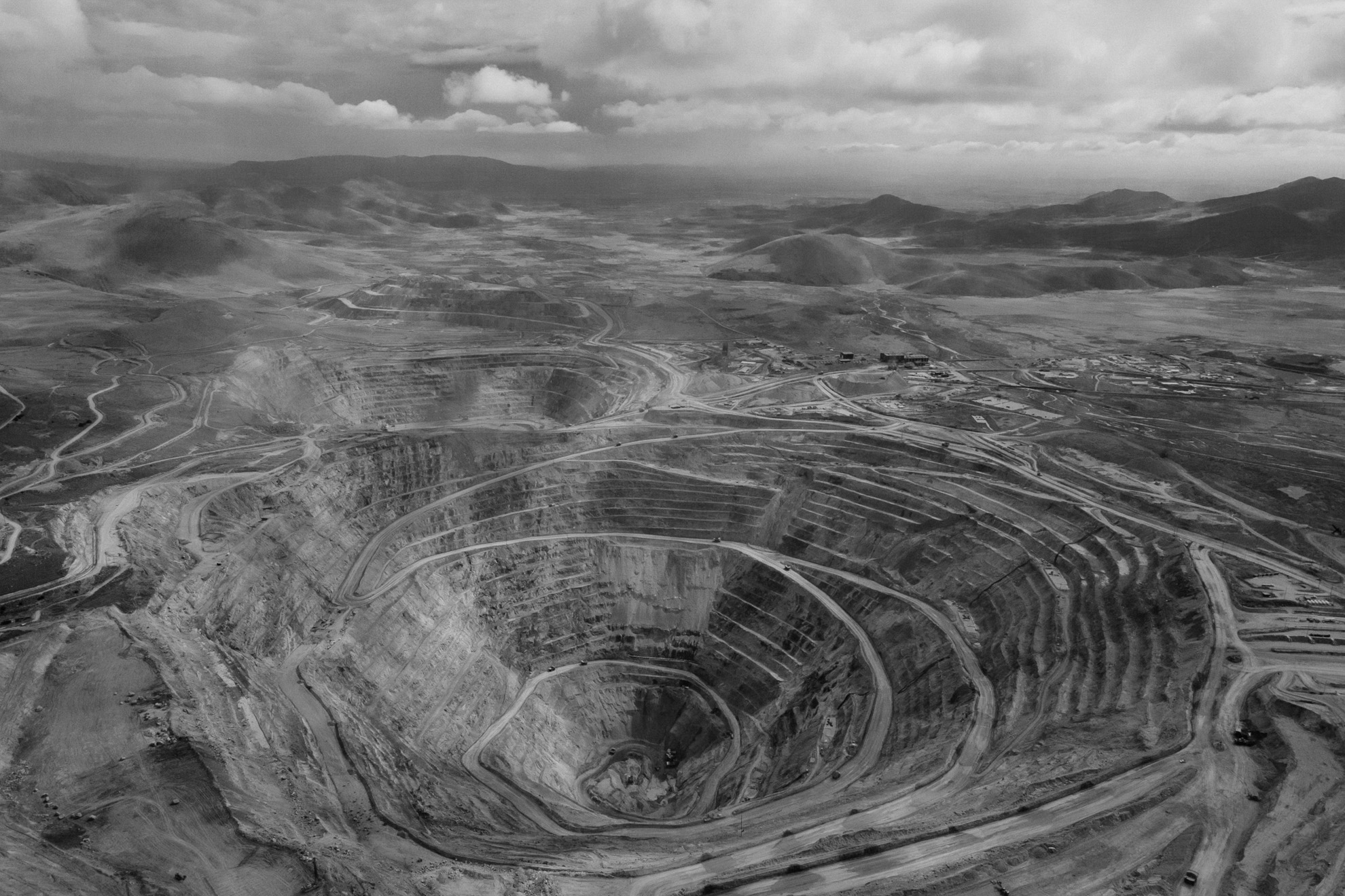 Air drone view of the Tintaya mine, Espinar, Peru. Large sections of territory have been bought by a powerful multinational (Glencore) that gives shape to the enormous extraction complexes of Tintaya, Antapaccay, and Coroccohuaycco (today about 40% of the district's territory is granted to mining companies) disappointing the inhabitants of the communities and causing a net deterioration of their conditions, creating a huge imbalance between the lifestyles of those working in the mines and those who do not. The major problems afflicting territories and populations of the Espinar area are contamination of water with heavy metals and the lack of water due to mining activity.