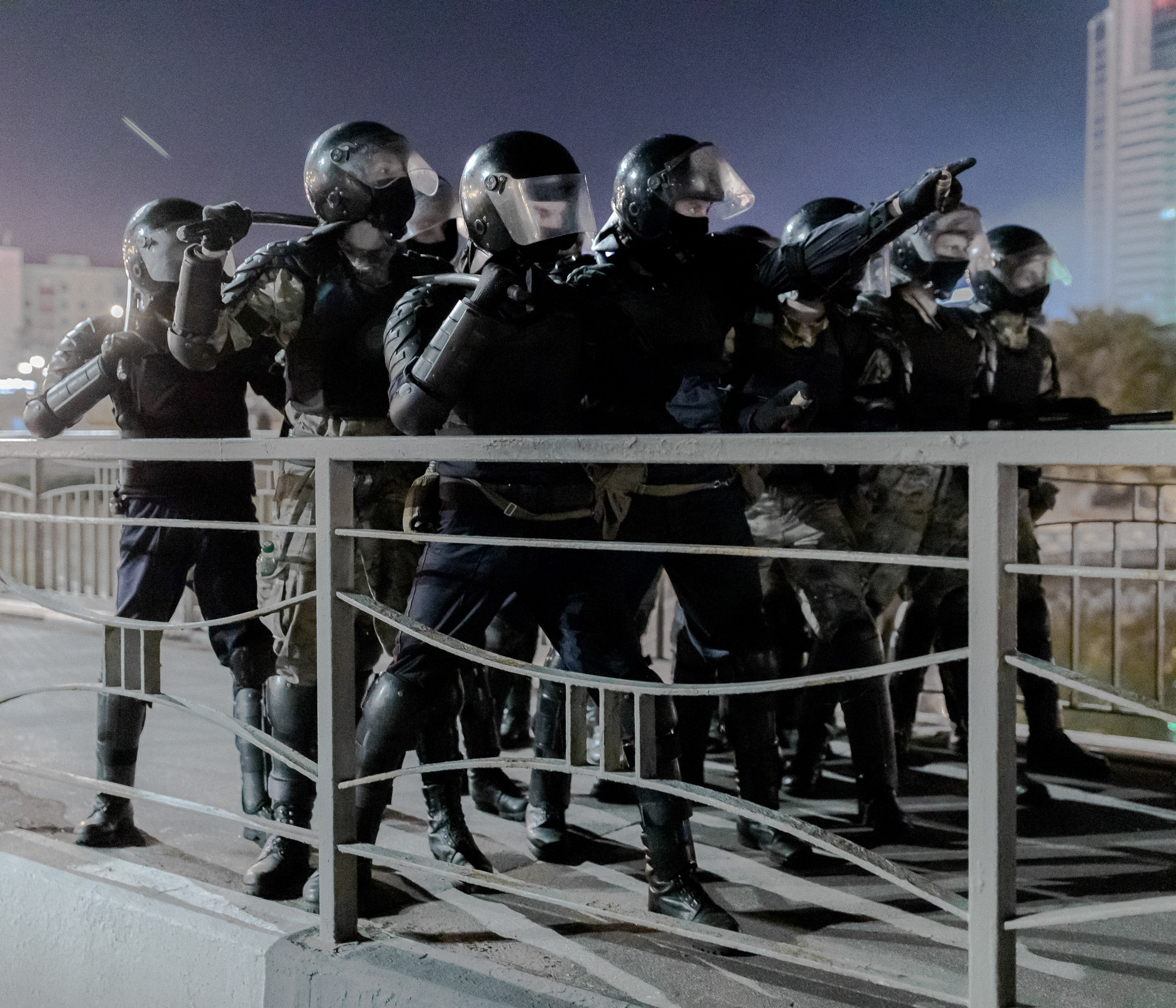 Police officers from OMON units stand on the bridge in Maksima Bahdanovic Street in the first hours of mass protests. The protests began on the night of August 9-10. The blockade formed by the police on the bridge was the site of the first direct clash between the protesters and the police.