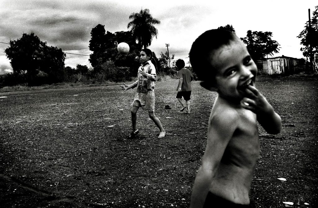 Children play in a village on the outskirts of Posadas, in the northwestern province of Misiones, Argentina, near the border with Paraguay. This rural area has a very high percentage of people affected by Chagas disease. Immediate symptoms are mild and often go unnoticed. Years later, 30% of infected persons develop chronic symptoms, suffering damage to the cardiovascular, nervous and digestive systems, lowering average life expectancy by approximately 9 years. There is no adequate treatment available. Children under 14 can be cured, but re-infection is always a threat.